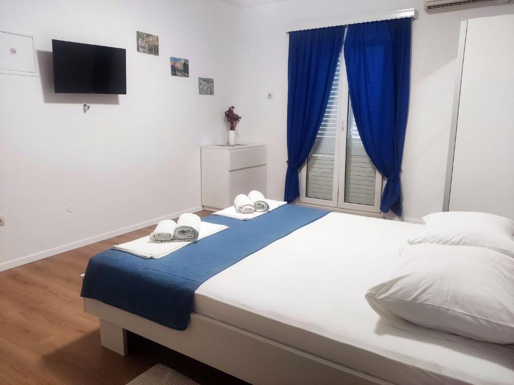 Posteľ alebo postele v izbe v ubytovaní Apartments Mat