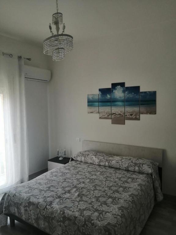 Łóżko lub łóżka w pokoju w obiekcie Sicilia Beddra