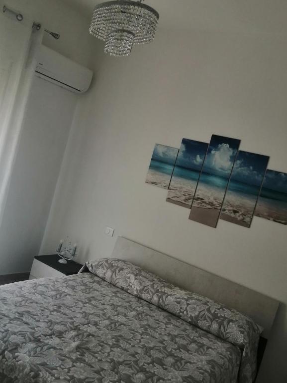 Łóżko lub łóżka w pokoju w obiekcie Sicilia Beddra