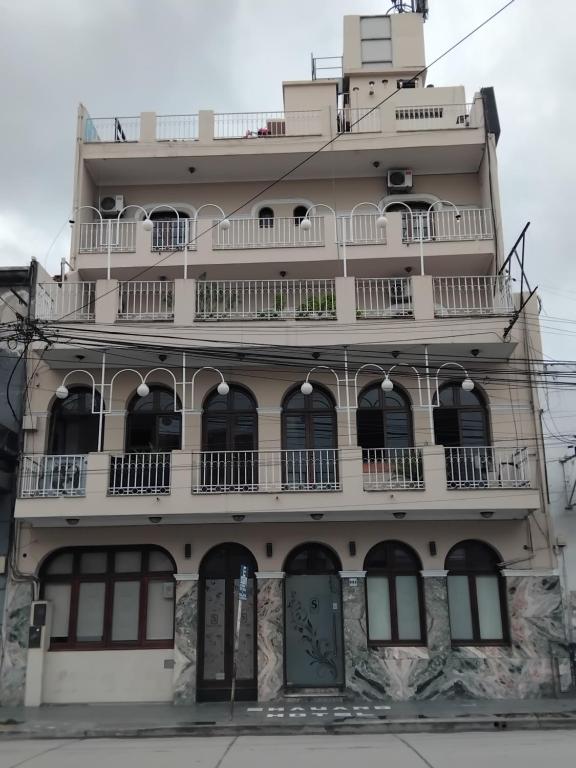 a tall building with balconies on the side of it at Hotel Shauard in Salta