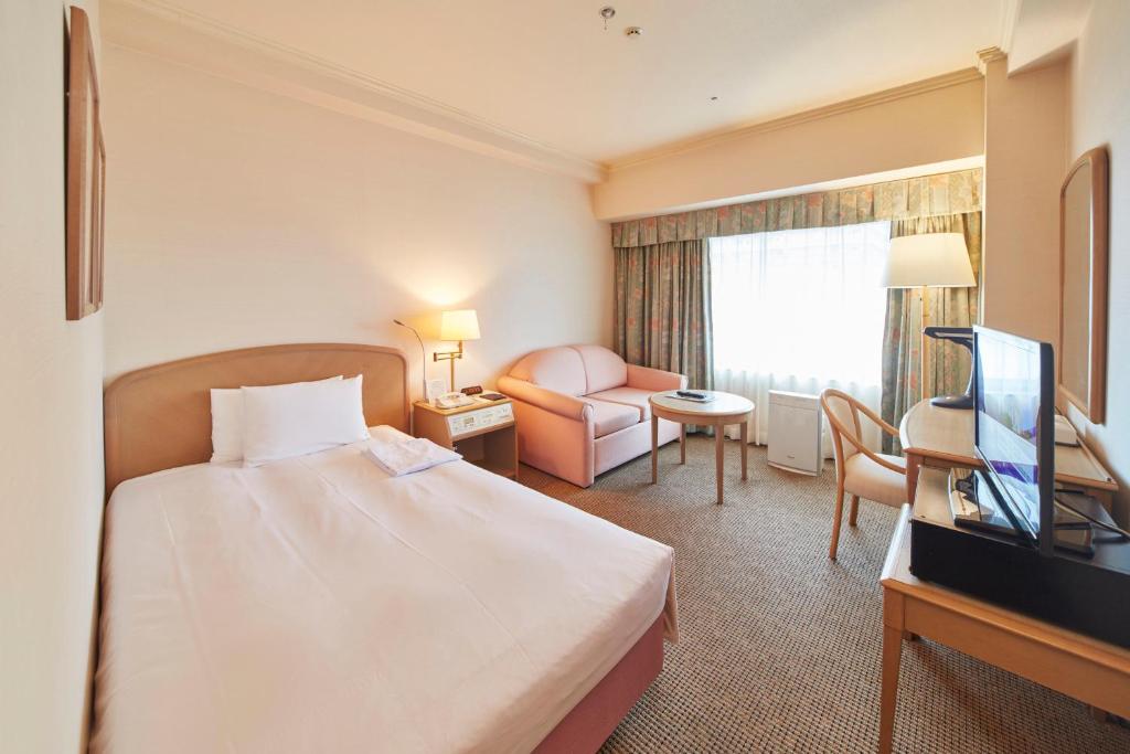TV a/nebo společenská místnost v ubytování Kobe Seishin Oriental Hotel