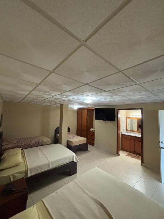 Postel nebo postele na pokoji v ubytování Residencial Tropical