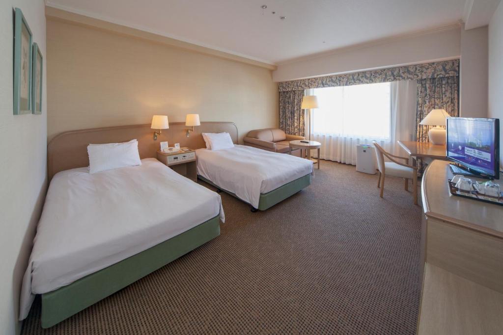 TV a/nebo společenská místnost v ubytování Kobe Seishin Oriental Hotel