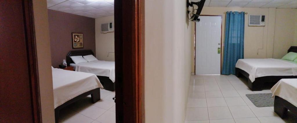 Postel nebo postele na pokoji v ubytování Residencial Tropical