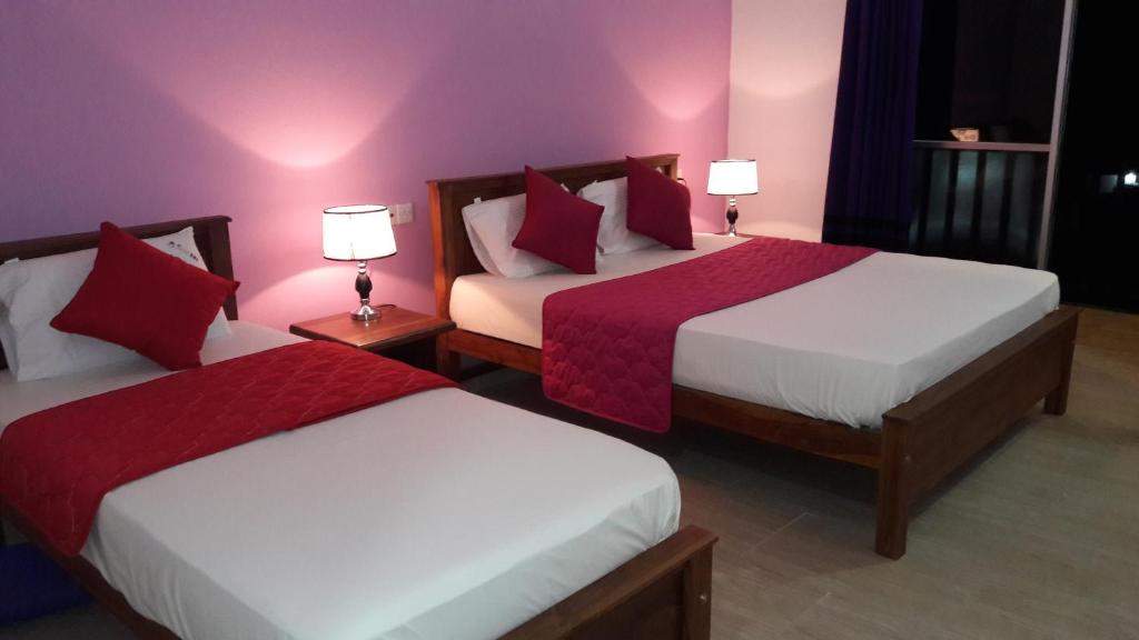 Postel nebo postele na pokoji v ubytování New Rani Inn
