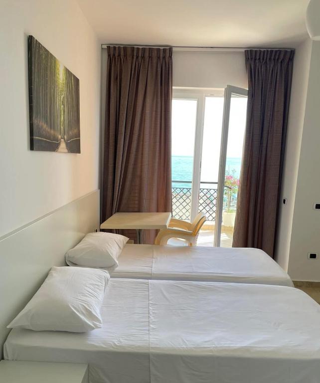 Postel nebo postele na pokoji v ubytování Hotel Brilant