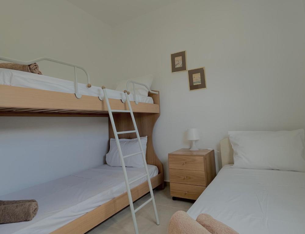 Postel nebo postele na pokoji v ubytování Olea Village Retreat