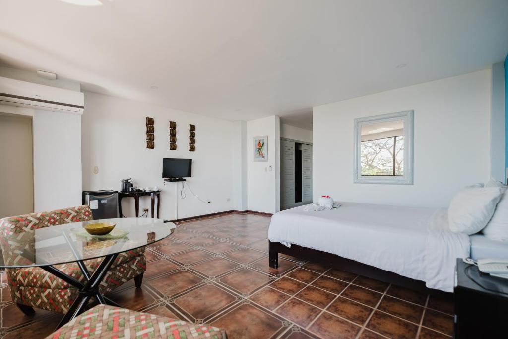 Postel nebo postele na pokoji v ubytování Layan Hotel & Spa