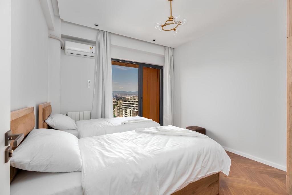 Postel nebo postele na pokoji v ubytování Hilton City Tbilisi