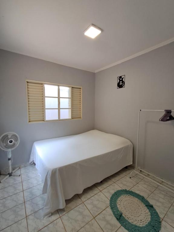 Ένα ή περισσότερα κρεβάτια σε δωμάτιο στο Mini house-Pouso Alto MG