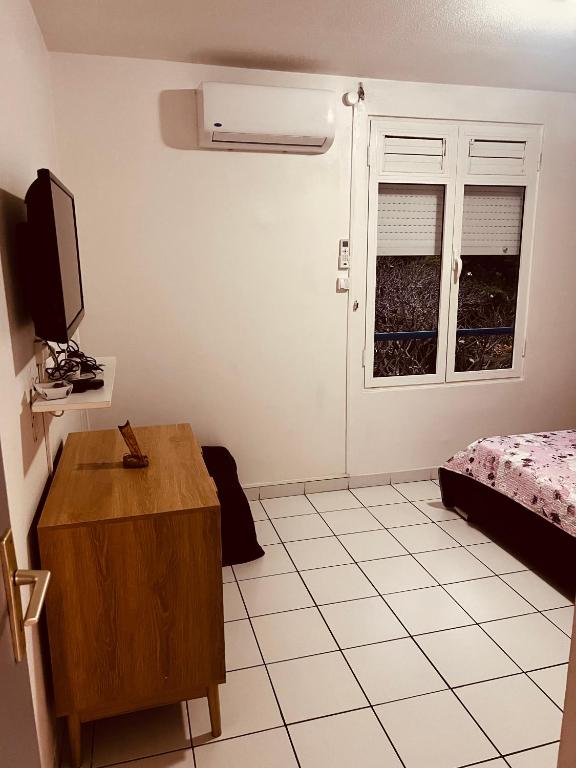 TV a/nebo společenská místnost v ubytování T2 tout confort Vue Panoramique