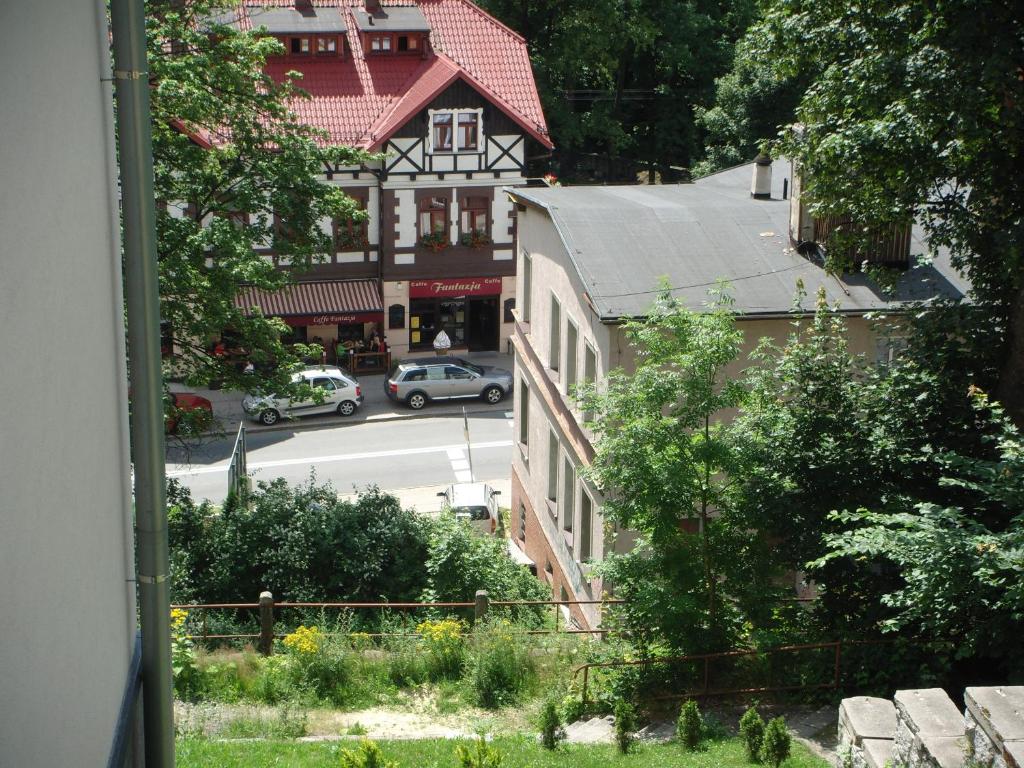 a view of a city street with cars on the road at Apartament Grześ in Szklarska Poręba