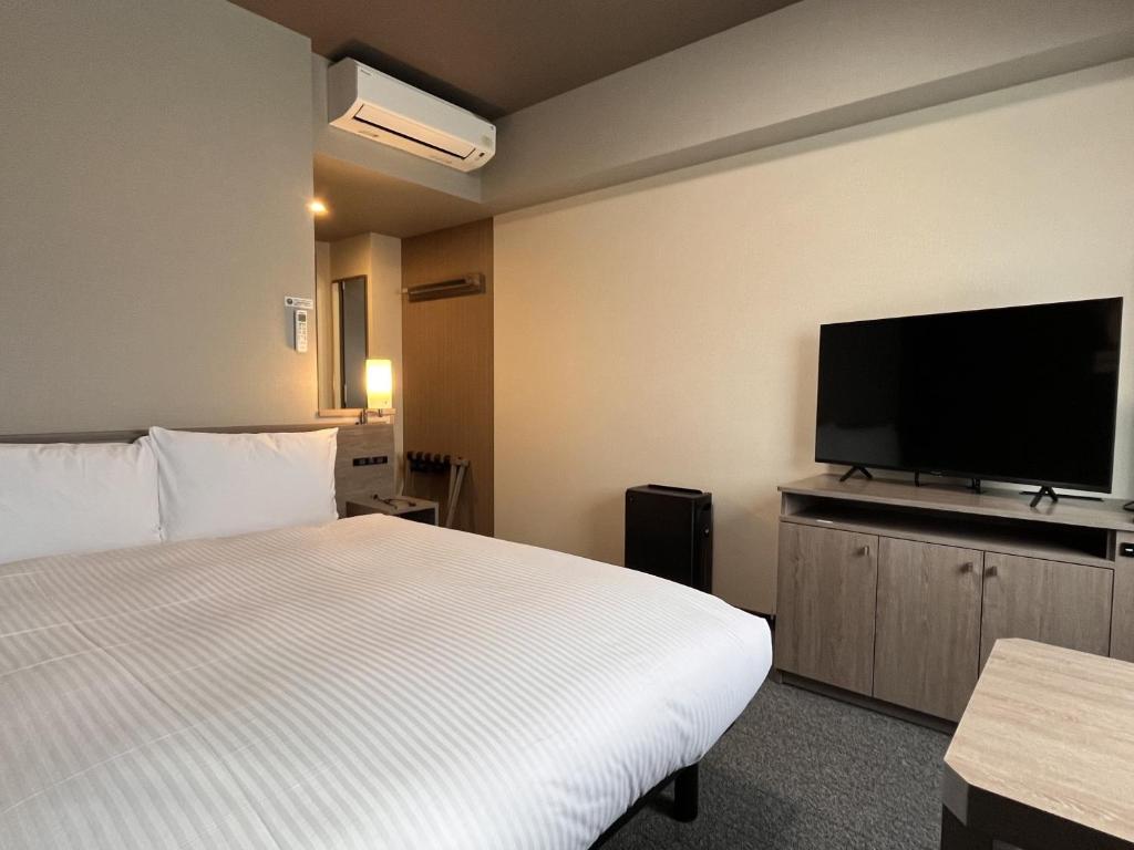 TV a/nebo společenská místnost v ubytování Hotel Route Inn Suzaka