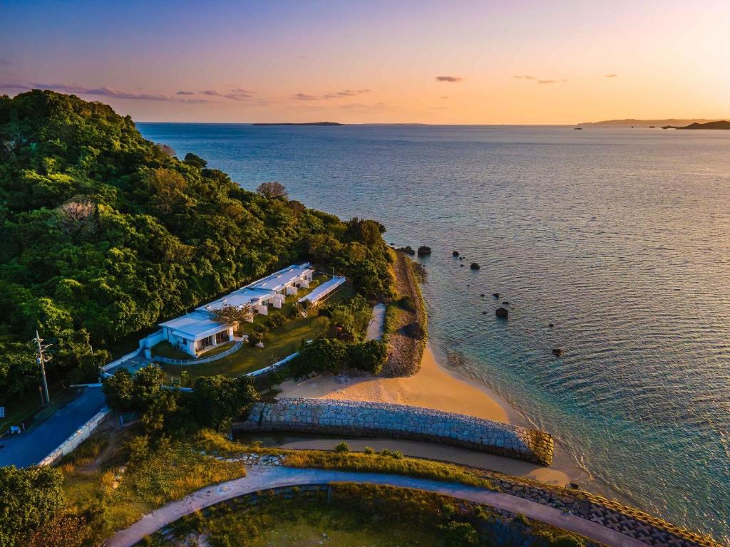 an aerial view of a beach with a house at 413 Hamahiga Hotel＆Cafe in Uruma