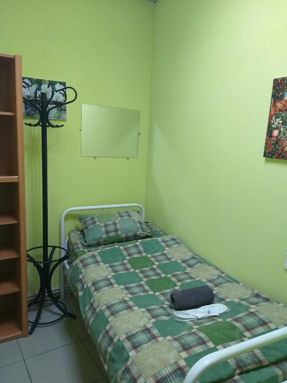 Postel nebo postele na pokoji v ubytování Sherlock Hotel