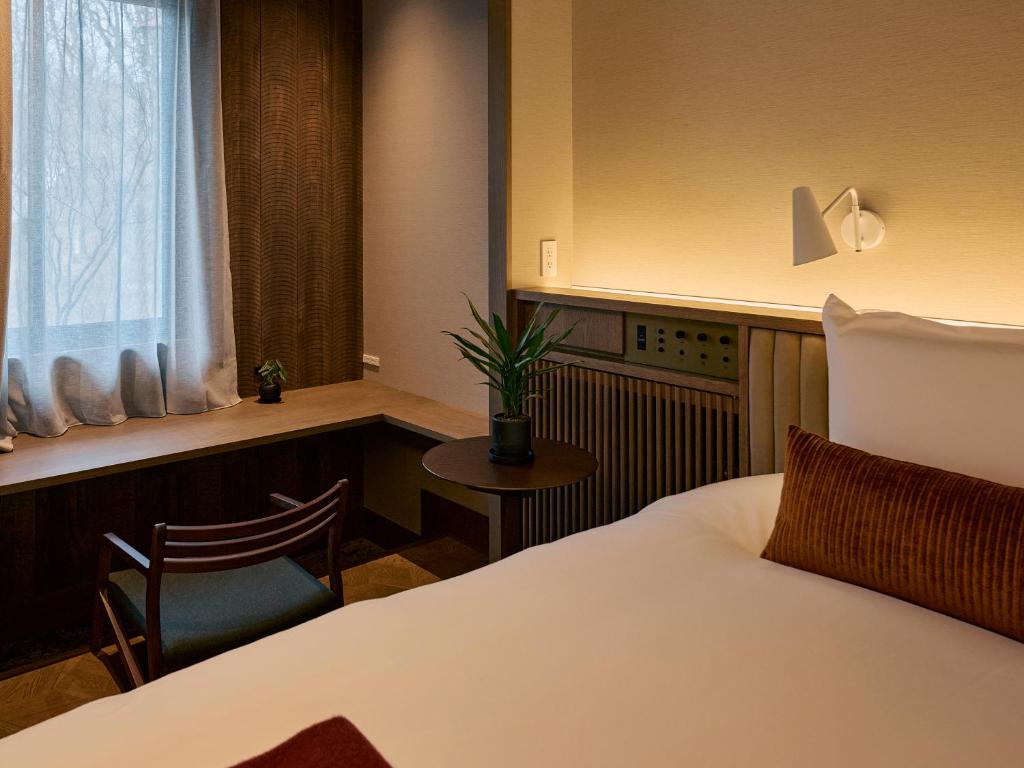 Postel nebo postele na pokoji v ubytování Glamdy style hotel suite 山ノ麓