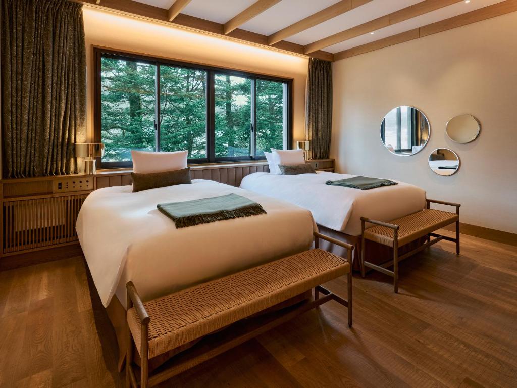 Postel nebo postele na pokoji v ubytování Glamdy style hotel suite 山ノ麓