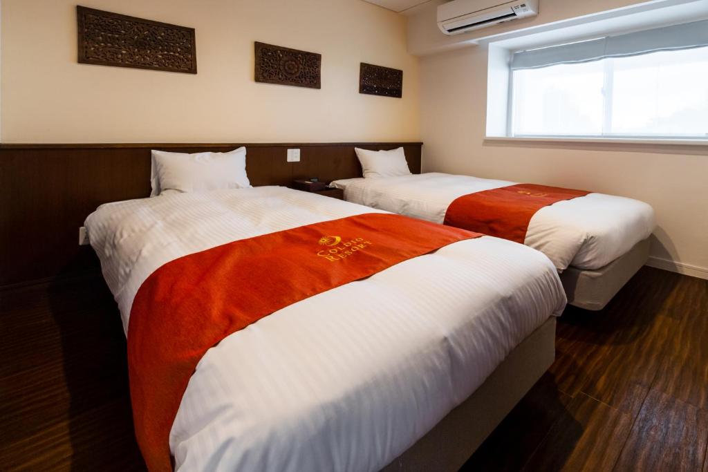 Private Villa Gushikumui by R Hotelにあるベッド