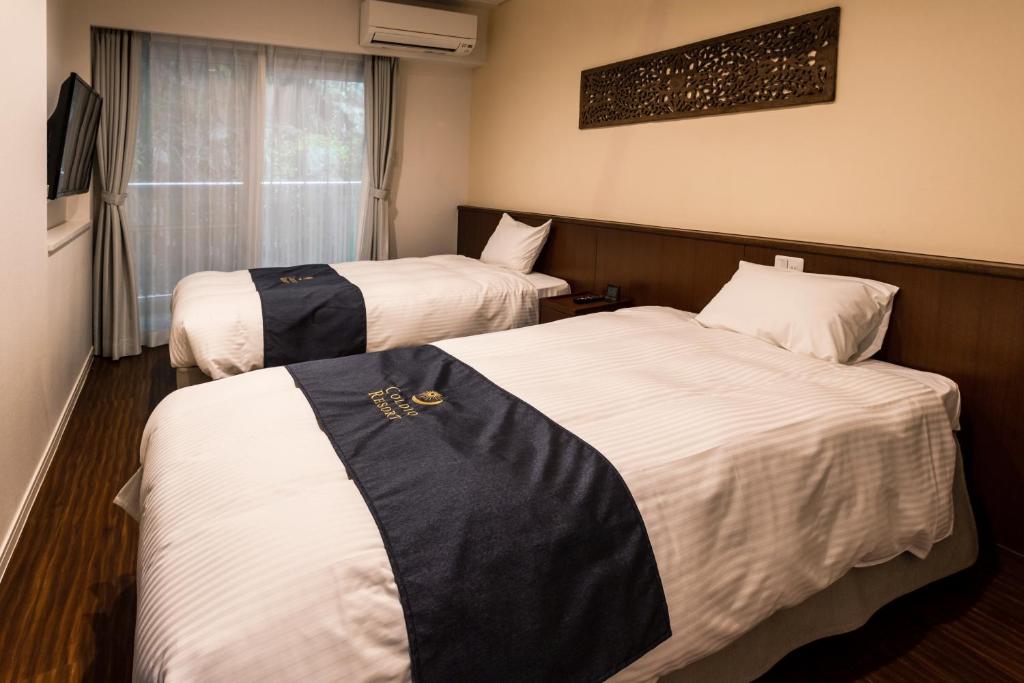Private Villa Gushikumui by R Hotelにあるベッド