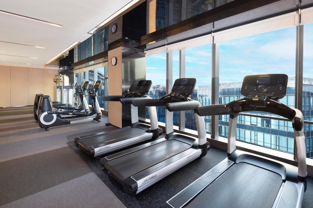 a gym with cardio equipment in a building at Hyatt House Shanghai Hongqiao CBD in Shanghai