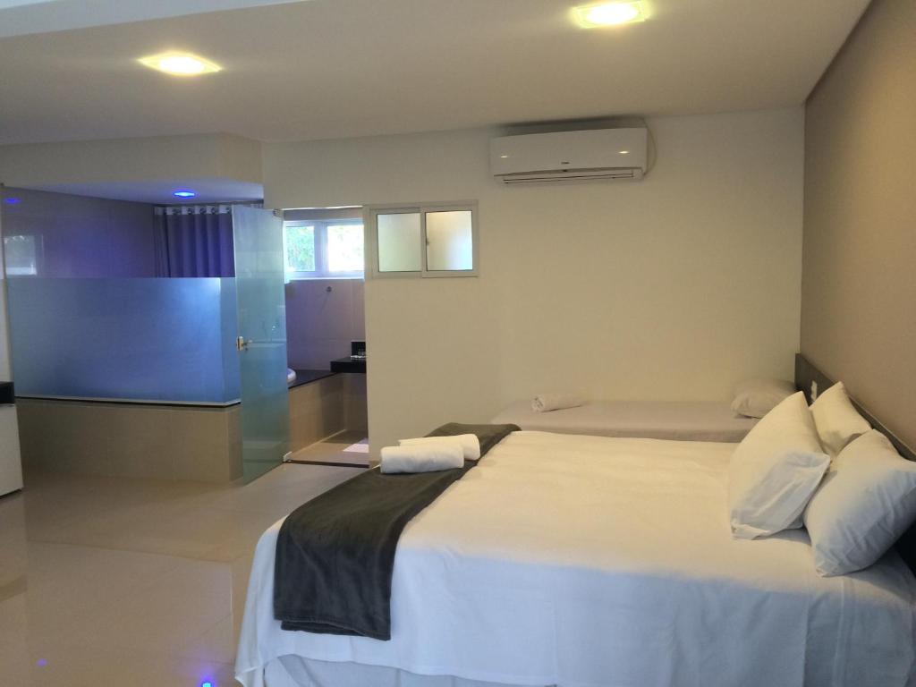 Cama ou camas em um quarto em Scenarium Hotel