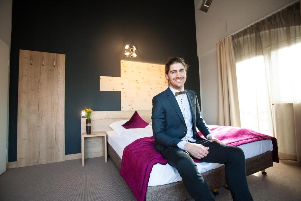 Postel nebo postele na pokoji v ubytování Amalienburg - Boutique & Boarding Hotel