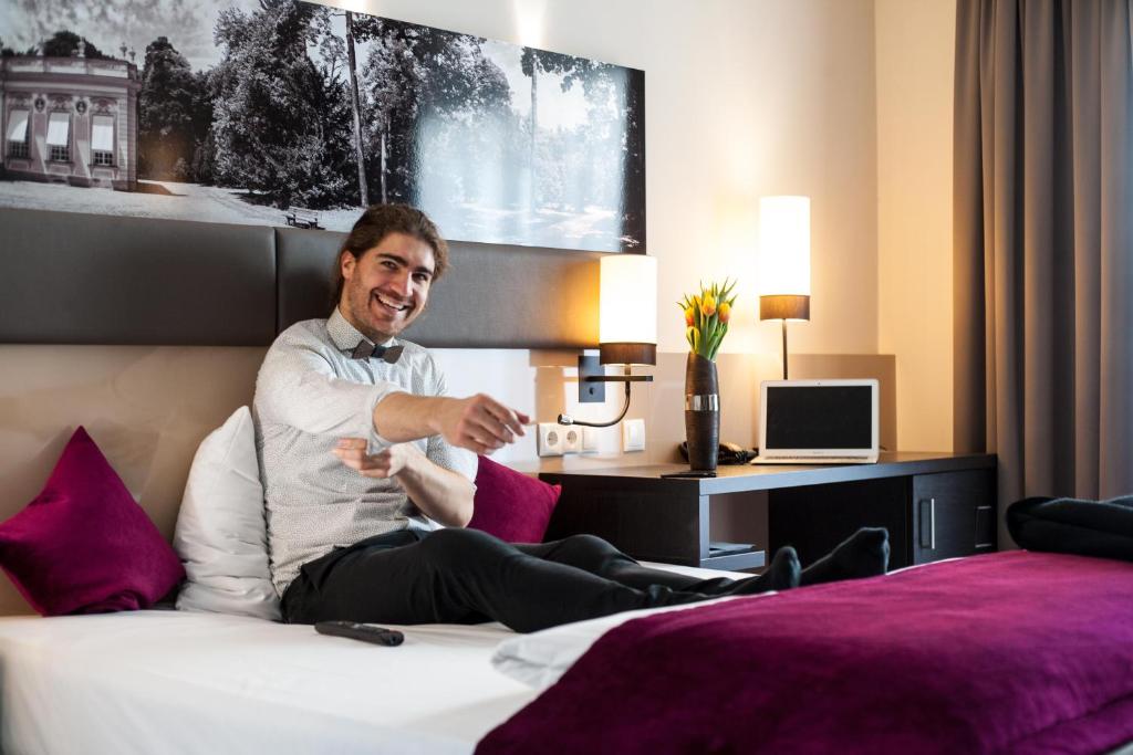 Postel nebo postele na pokoji v ubytování Amalienburg - Boutique & Boarding Hotel