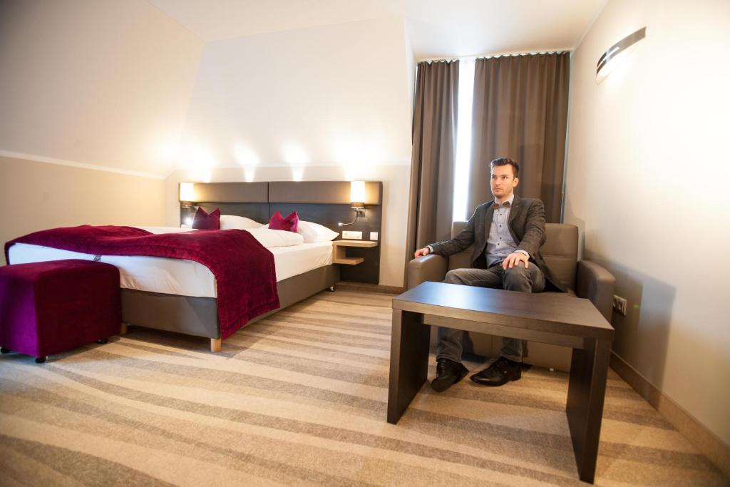 Postel nebo postele na pokoji v ubytování Amalienburg - Boutique & Boarding Hotel
