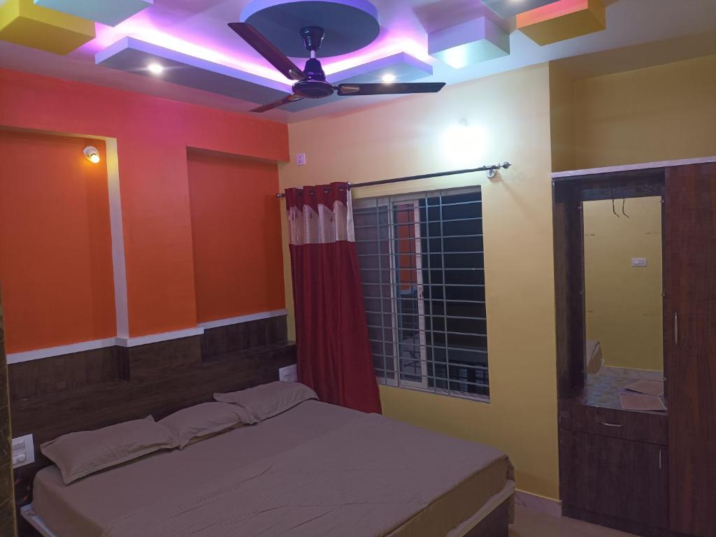 Ένα ή περισσότερα κρεβάτια σε δωμάτιο στο Banashree Guest inn