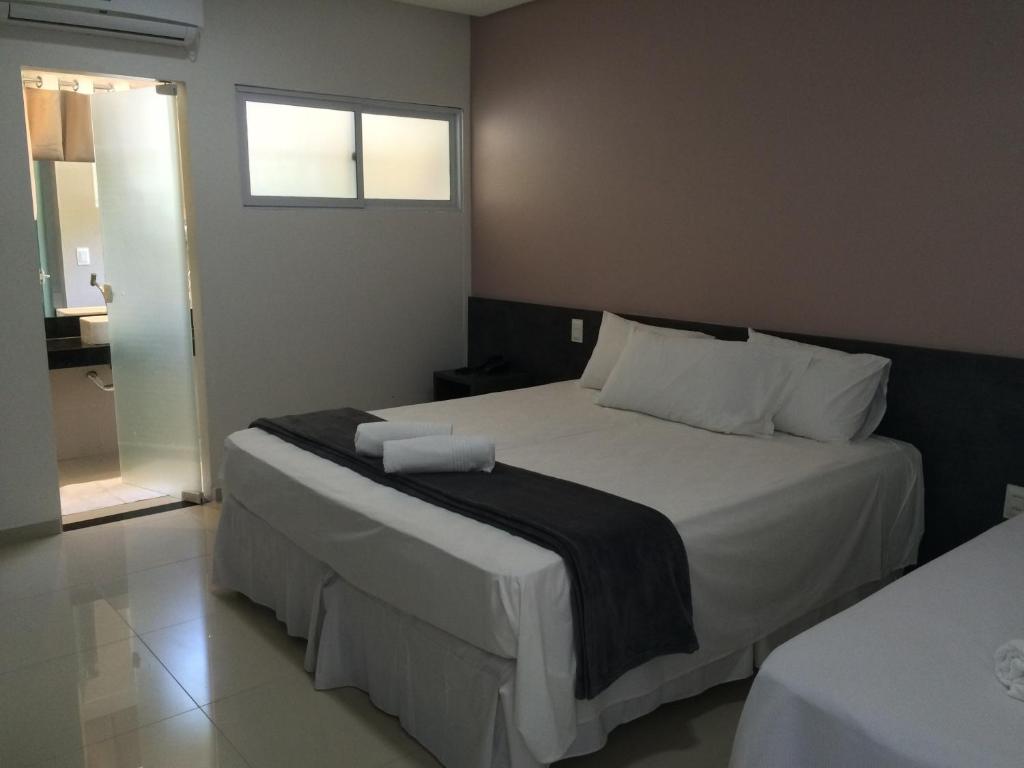 Cama ou camas em um quarto em Scenarium Hotel