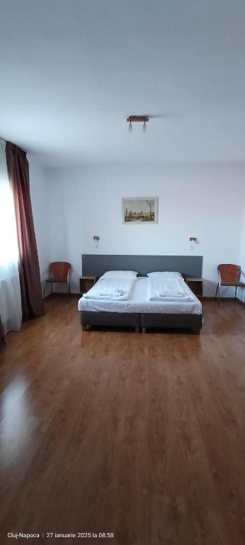 Postel nebo postele na pokoji v ubytování Hotel Liliacul