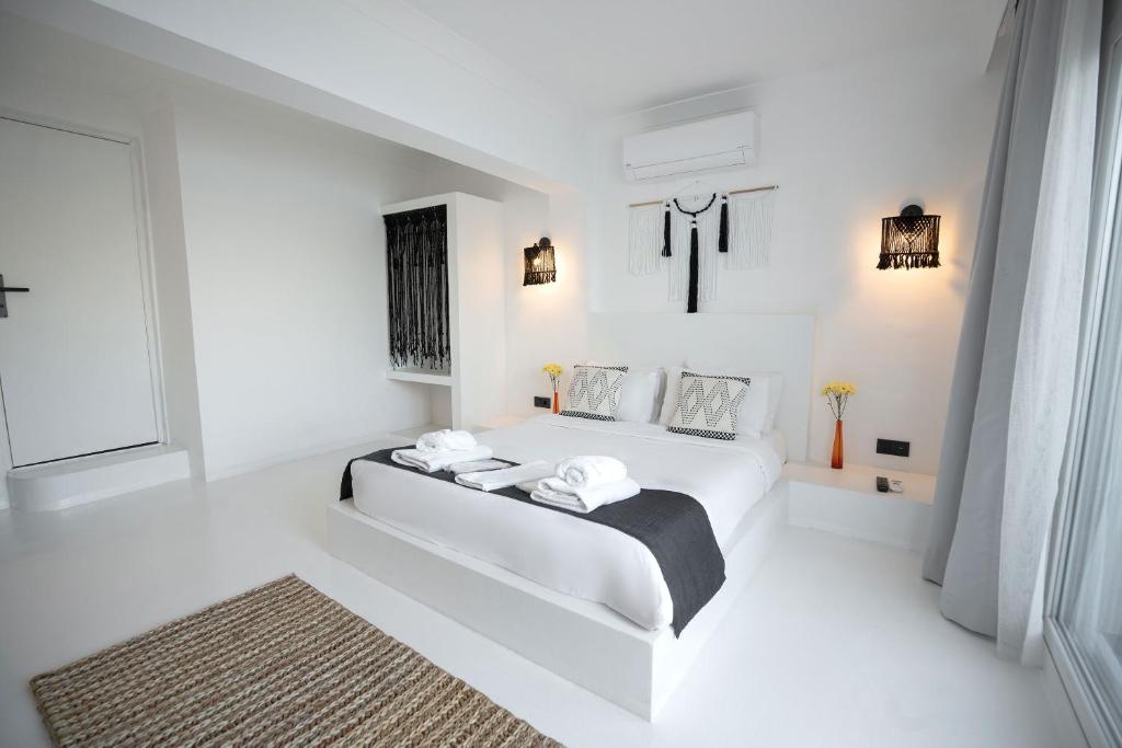 Postel nebo postele na pokoji v ubytování Çamlık 87 Hotel Ayvalık