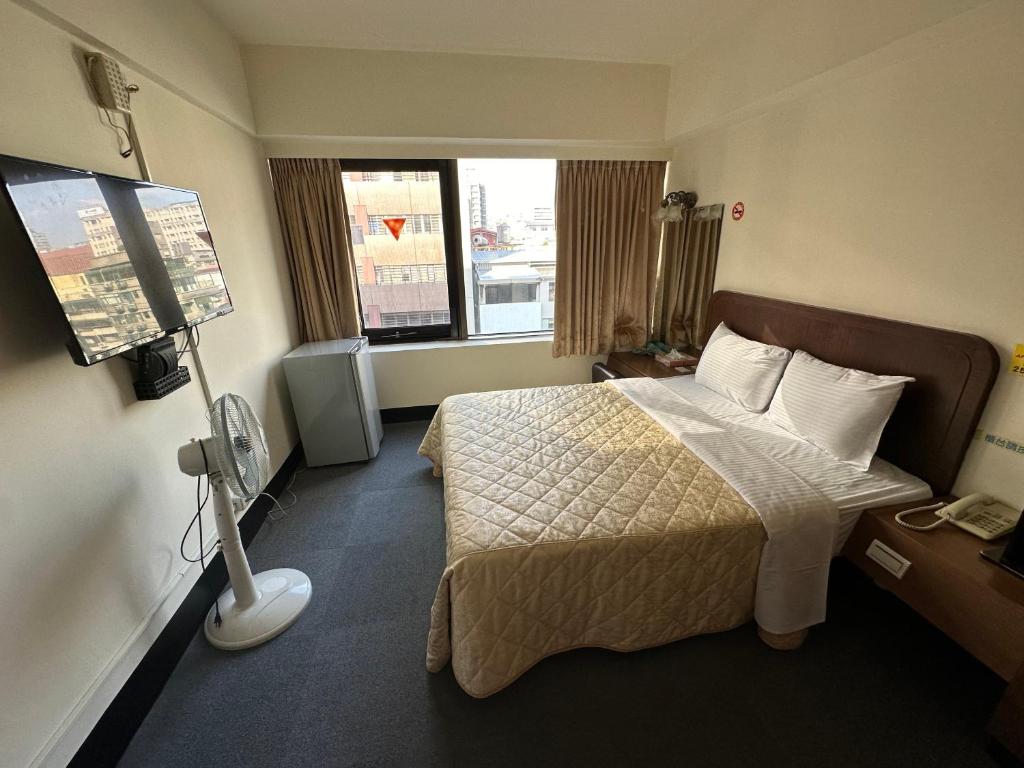 Postel nebo postele na pokoji v ubytování Chian Huei Business Hotel
