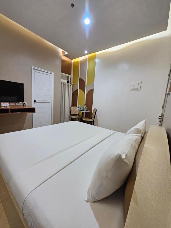Postel nebo postele na pokoji v ubytování Hotel Nicanor
