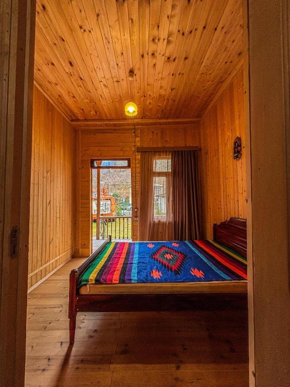 Postel nebo postele na pokoji v ubytování Gomi Riverside