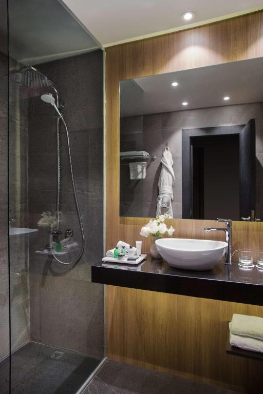 a bathroom with a sink and a shower at NH Collection Buenos Aires Jousten in Buenos Aires
