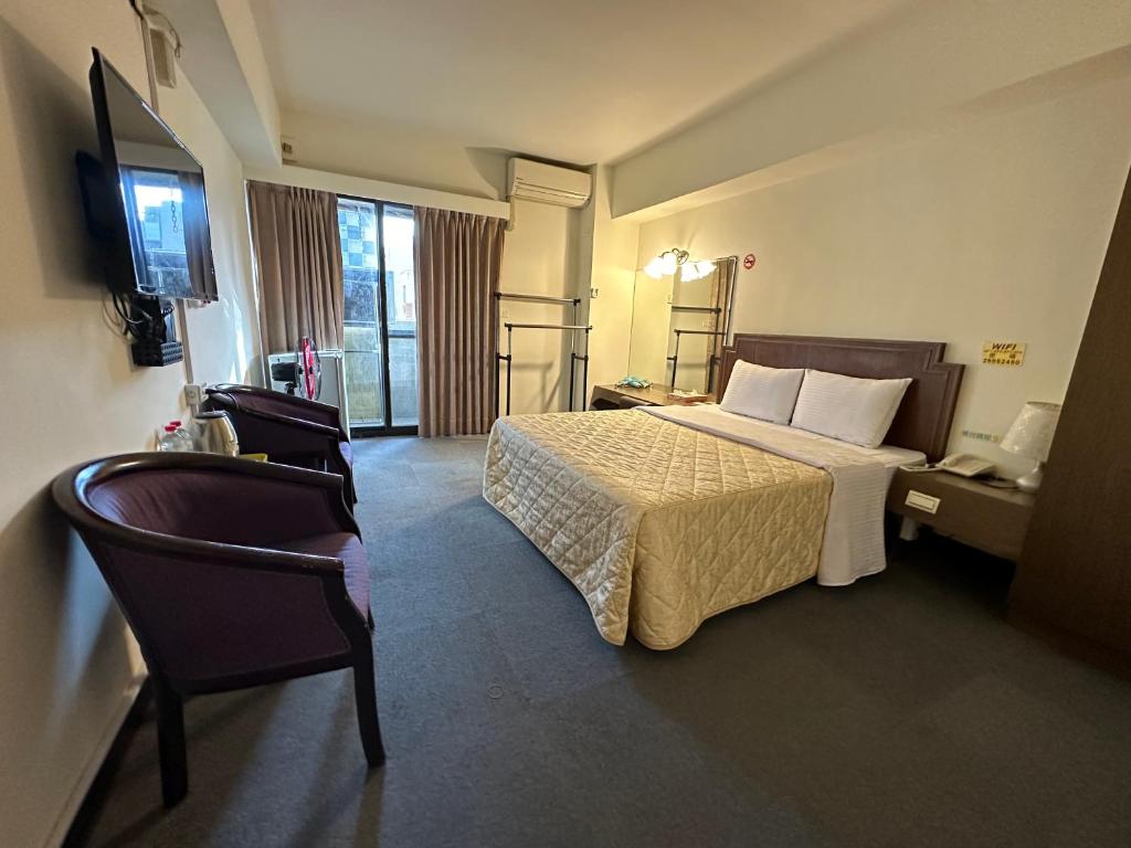 Postel nebo postele na pokoji v ubytování Chian Huei Business Hotel