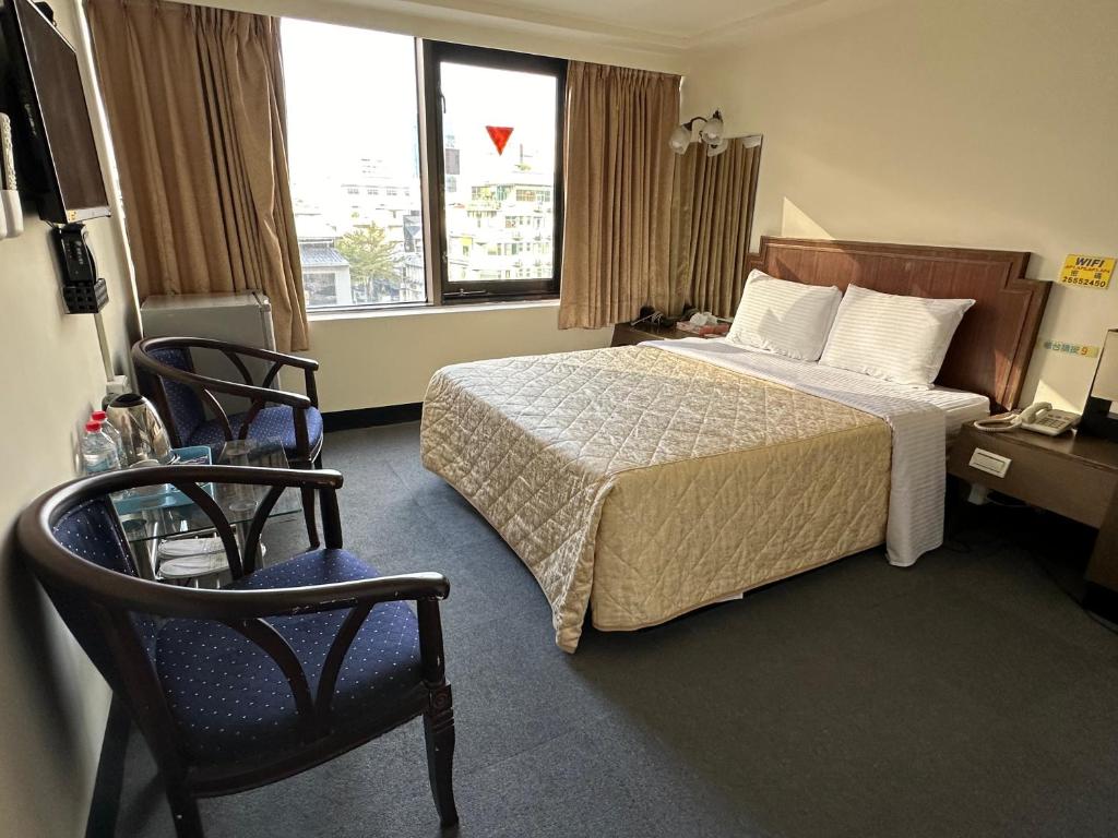 Postel nebo postele na pokoji v ubytování Chian Huei Business Hotel