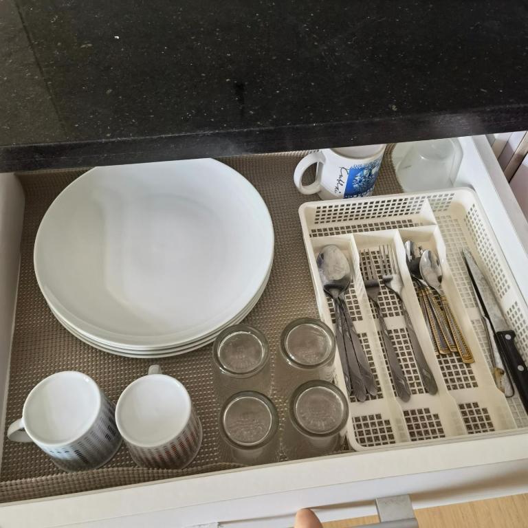 a drawer filled with dishes and other kitchen utensils at Avida Davao Condos, downtown CM Recto Avenue, Davao City in Davao City