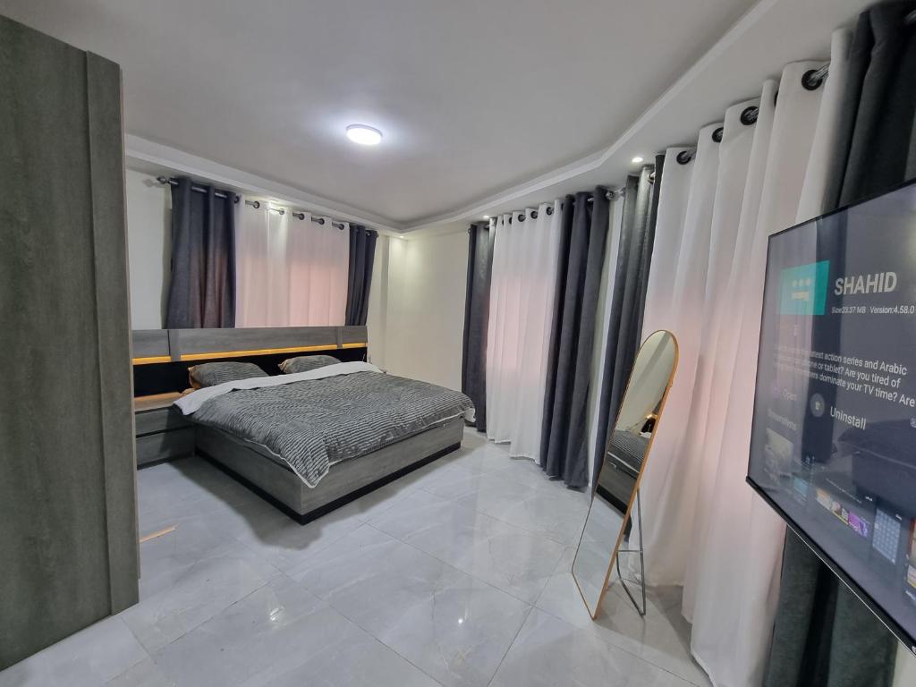 Llit o llits en una habitació de Sama Dier Ghbar 1