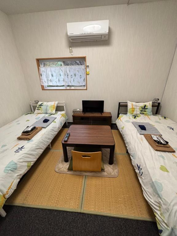 Postel nebo postele na pokoji v ubytování Hostel John Mang ゲストハウス ジョン