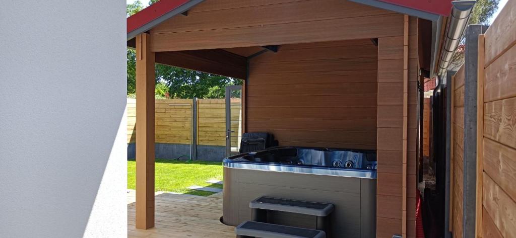 a kitchen under a pavilion with a sink at Bleu cargo in Biscarrosse