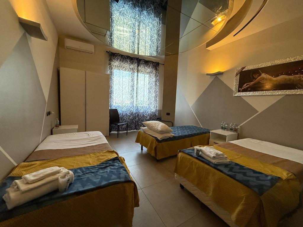 A bed or beds in a room at La Gritta srl