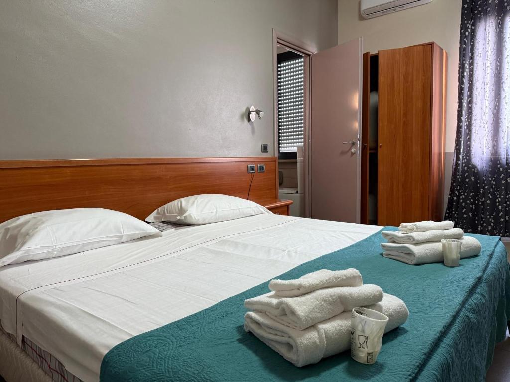 A bed or beds in a room at La Gritta srl