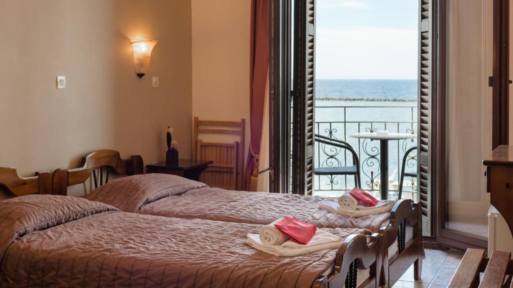 Postel nebo postele na pokoji v ubytování Poseidonio Hotel