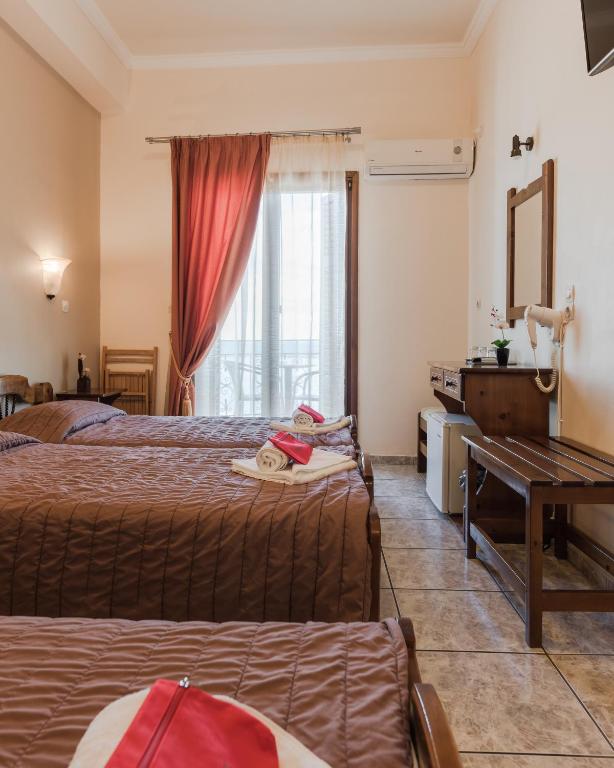 Postel nebo postele na pokoji v ubytování Poseidonio Hotel