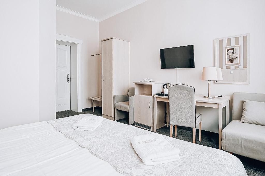 Postel nebo postele na pokoji v ubytování Hotel Amalia