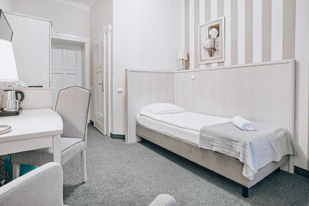 Postel nebo postele na pokoji v ubytování Hotel Amalia