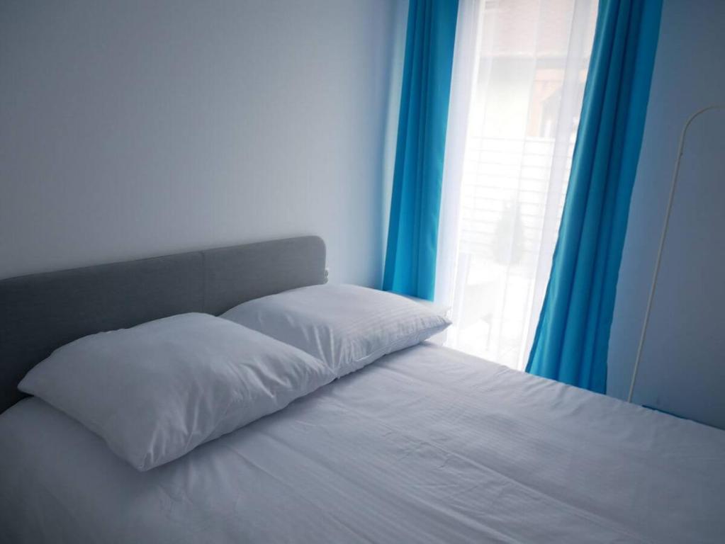 Posteľ alebo postele v izbe v ubytovaní Wisełka Apartamenty Sea & Lake