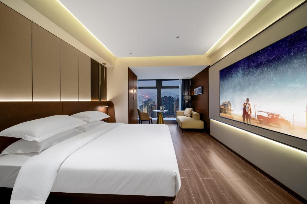 Postel nebo postele na pokoji v ubytování Chongqing Junsheng Yunduan Riverview Hotel
